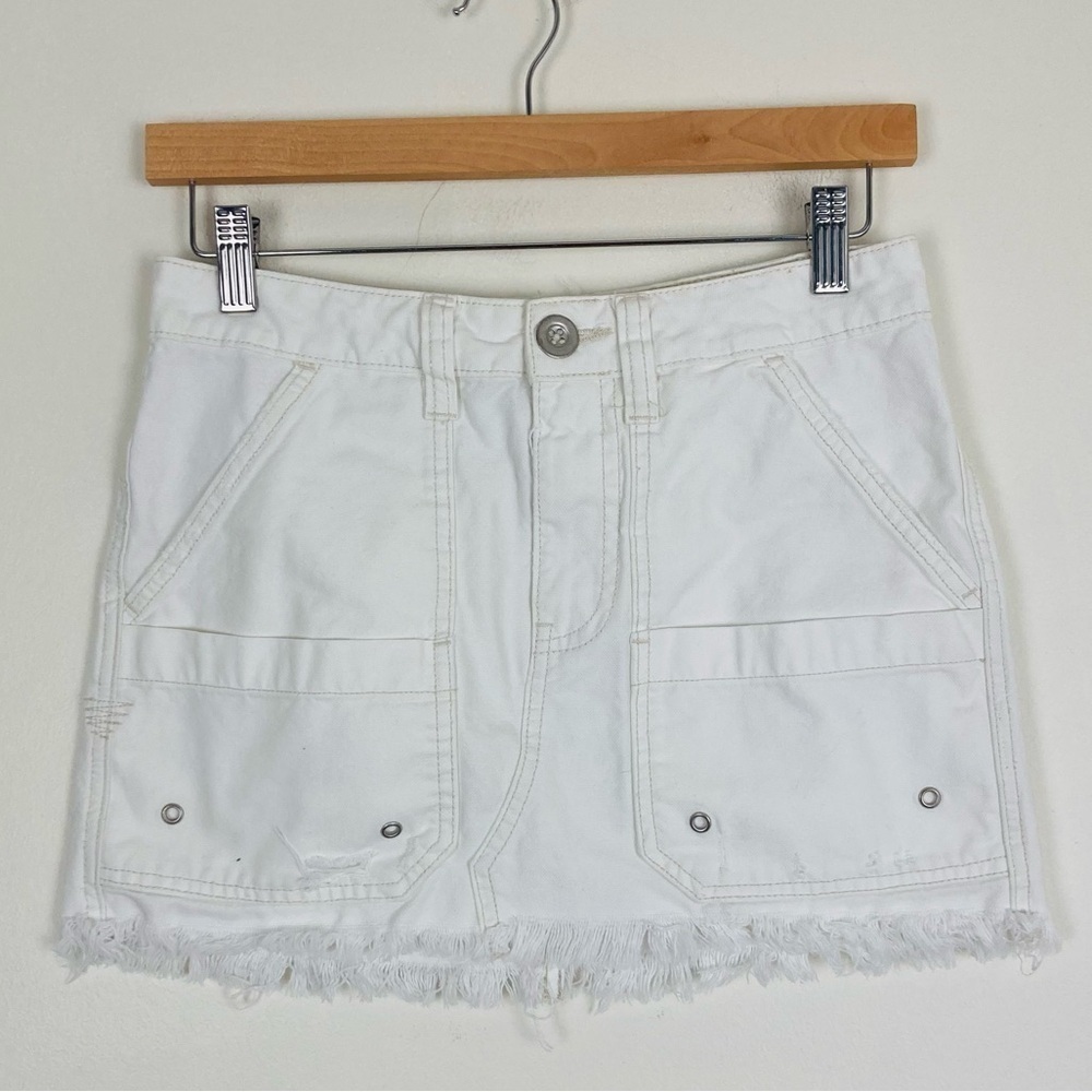 We the Free raw hem cargo mini skirt in white denim. Size 24